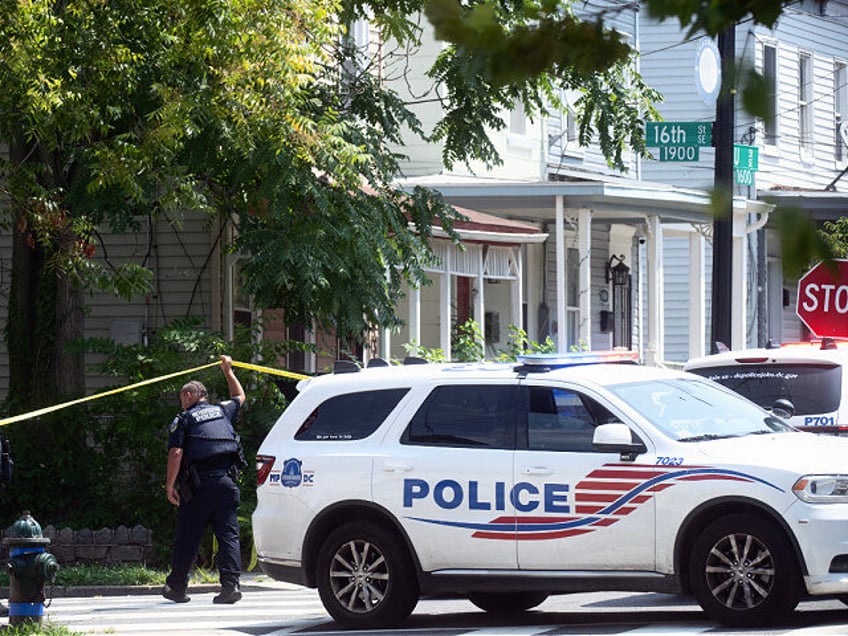 WASHINGTON, DC -AUGUST 06: Police patrol and continue to investigate where three people were shot and killed in an outbreak of gunfire in the Anacostia area of Southeast Washington Saturday night. We cover the aftermath of the shootings in Washington, DC on August 06, 2023. (Photo by Marvin Joseph/The Washington …