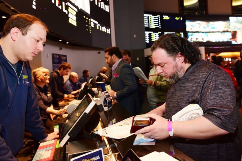 Fans gather at William Hill Sports Book at Ocean Resort Casino to place legalized sports bets on Super Bowl Sunday for the first time ever on...