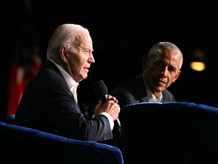 US President Joe Biden (L) speaks next to former US President Barack Obama onstage during