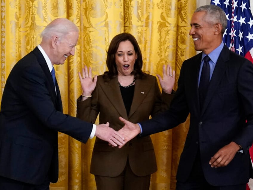 Vice President Kamala Harris reacts as President Joe Biden and former President Barack Oba