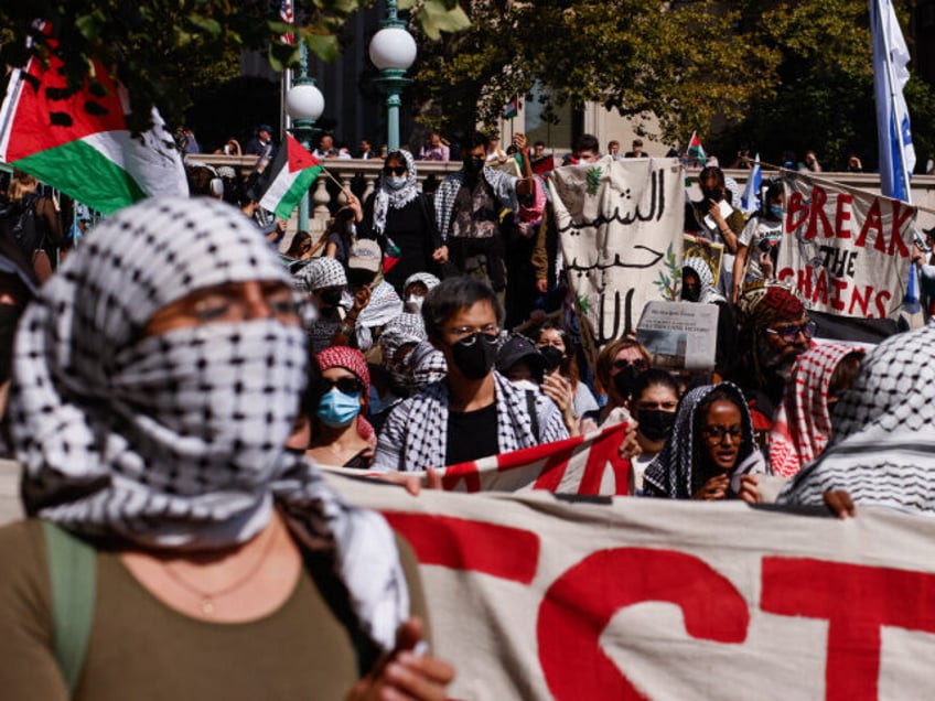 Pro-Palestinian demonstrators march through the Columbia University campus to mark one yea