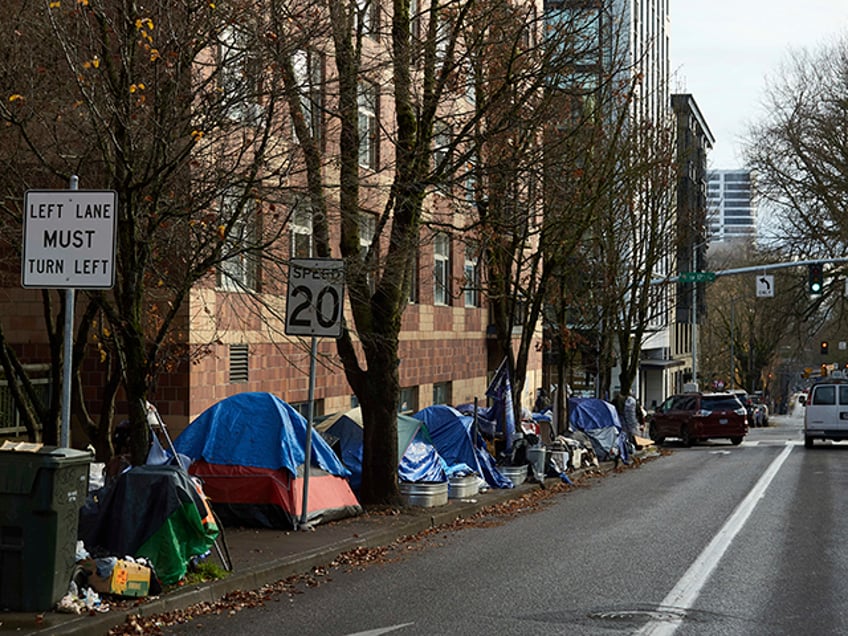 Tents line the sidewalk on SW Clay St in Portland, Ore., on Dec. 9, 2020. People with disa