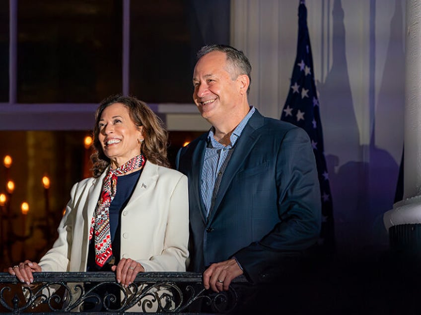 Vice President Kamala Harris and Second Gentleman Doug Emhoff view the Fourth of July fire