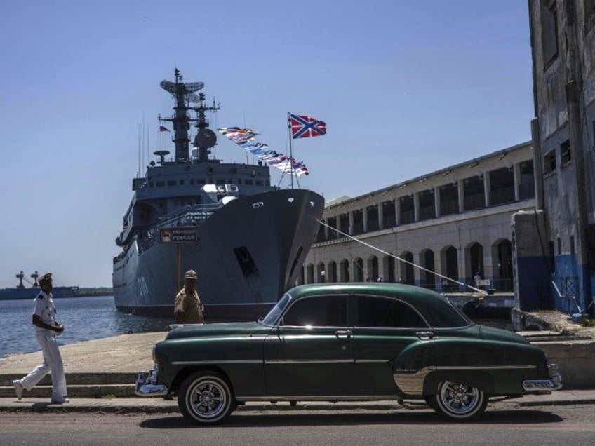 A Cuban sailor walks past the Russian Navy training ship, Perekop, in Havana Bay, Cuba, Tu