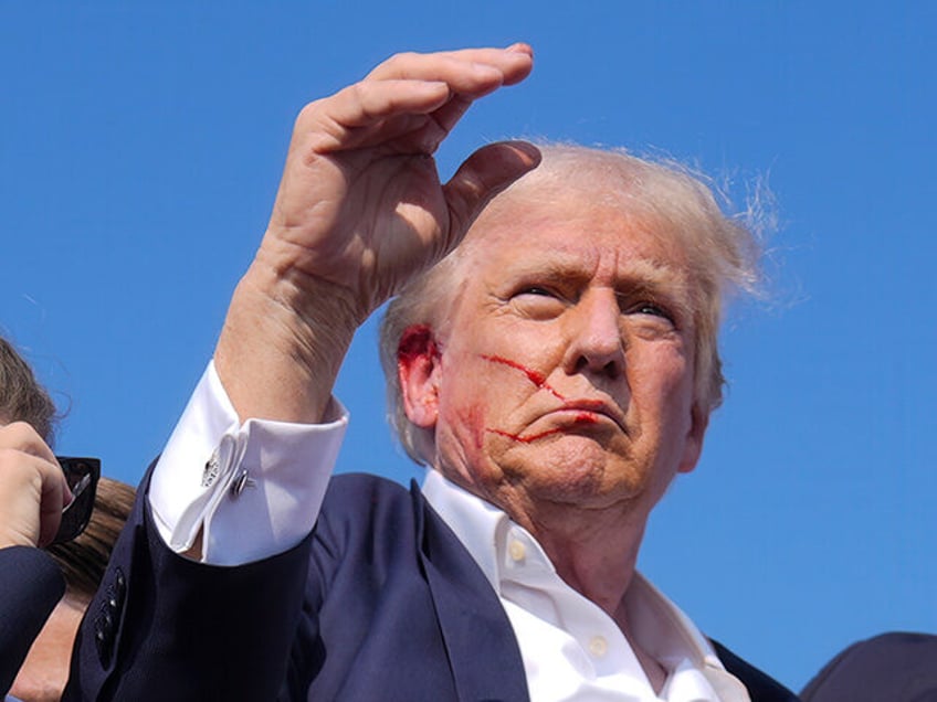 Republican presidential candidate former President Donald Trump waves from the stage as he