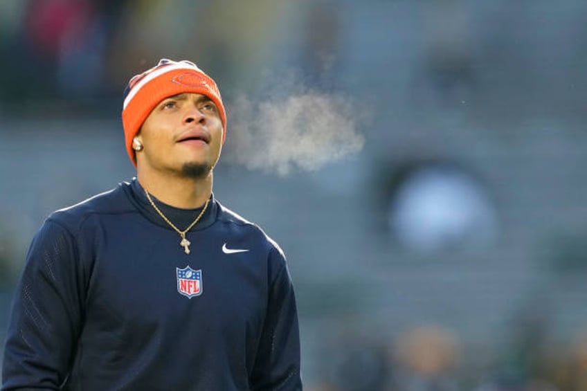 Justin Fields of the Chicago Bears warms up before a game against the Green Bay Packers at Lambeau Field on January 07, 2024 in Green Bay, Wisconsin.