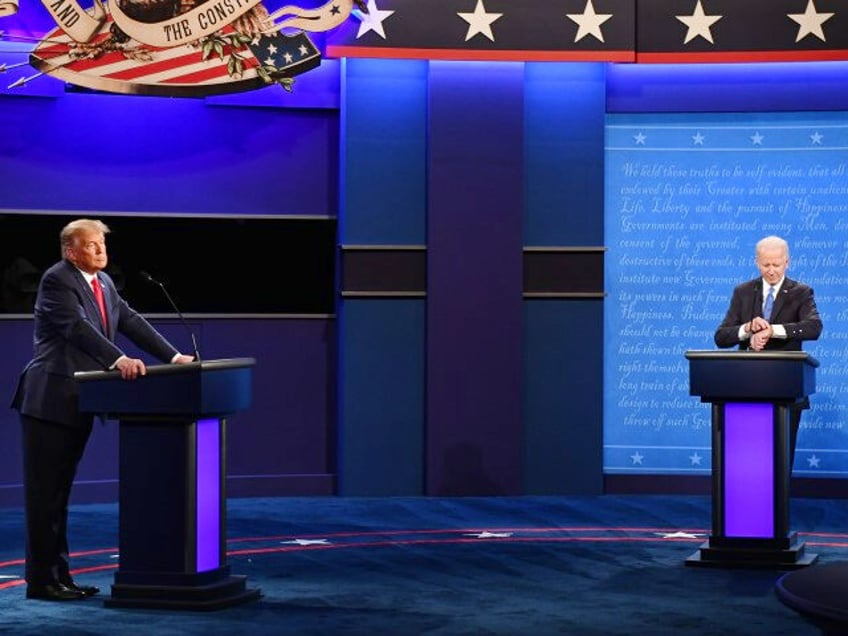 Joe Biden, 2020 Democratic presidential nominee, right, looks at his watch as President Donald Trump, left, pauses during the U.S. presidential debate at Belmont University in Nashville, Tennessee, on Thursday, Oct. 22, 2020. Trump and Biden will square off for 90 minutes in their final debate, but the biggest risk …