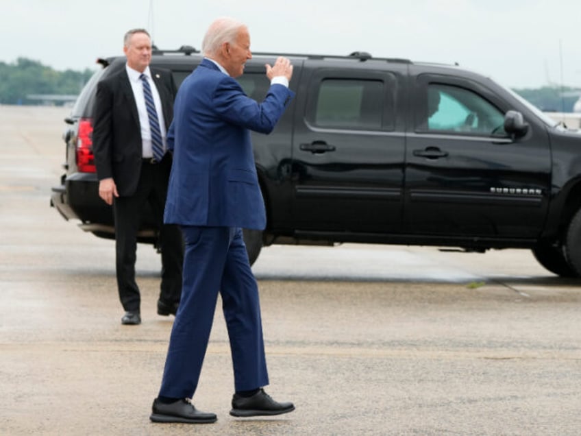 Downloaded 7/18/24 | President Joe Biden salutes as he walks to board Air Force One at And