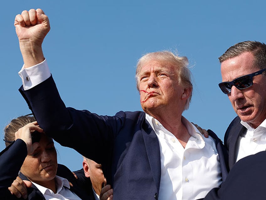 Republican presidential candidate former President Donald Trump pumps his fist as he is ru