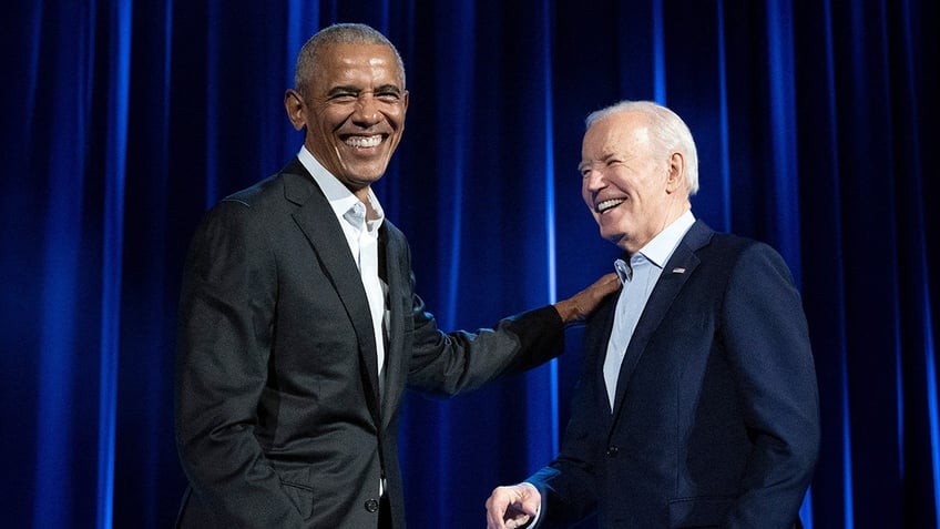 joe biden and barack obama smiling together