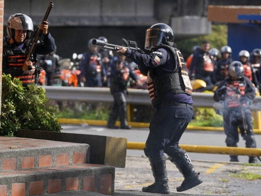 Police aim at protesters demonstrating against the official election results after elector