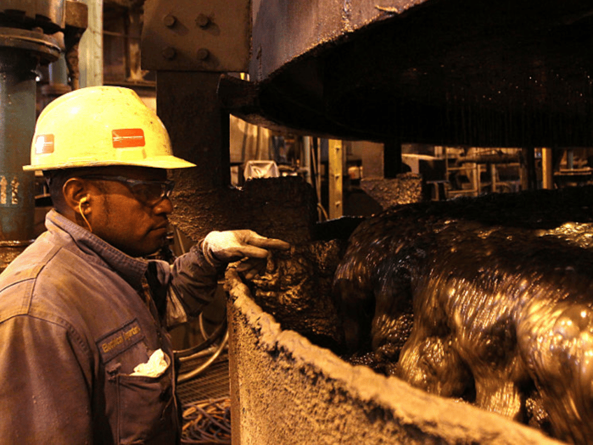A worker monitors operations as water is added to concentrate at Freeport McMoRan Inc.'s G