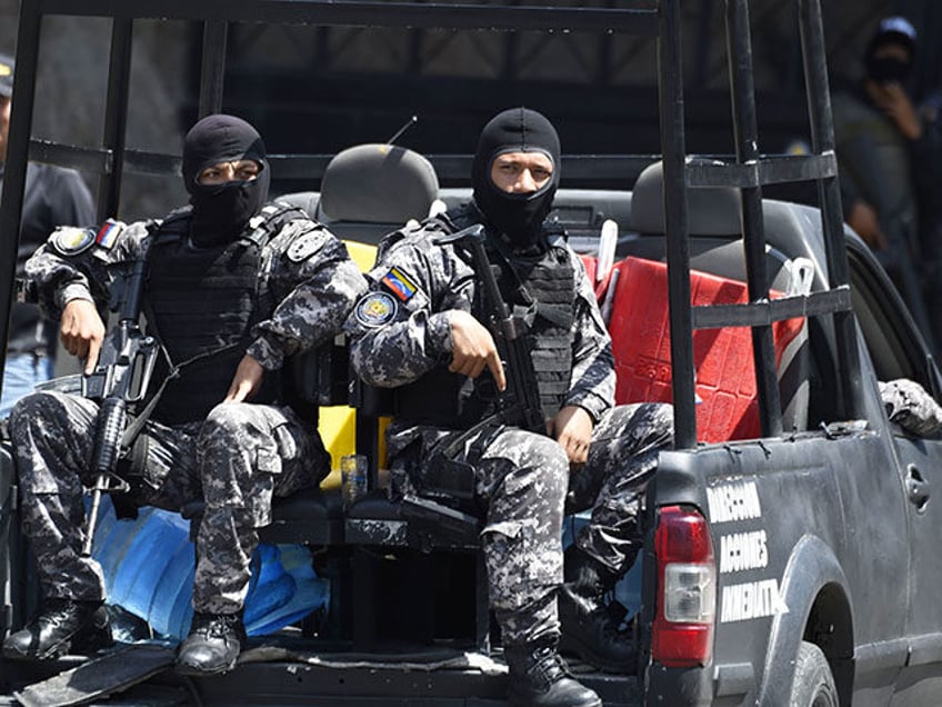 Security forces are seen at the entrance of El Helicoide, the headquarters of the Bolivari