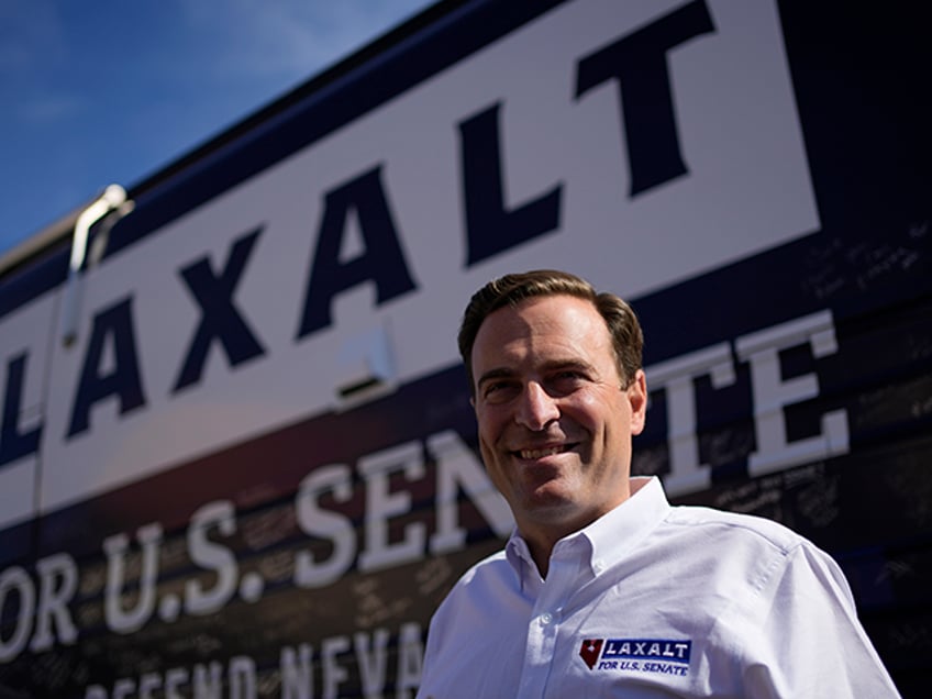 Nevada Republican Senate candidate Adam Laxalt meets with supporters at a campaign stop Saturday, Nov. 5, 2022, in Las Vegas. Laxalt is running against Sen. Catherine Cortez Masto, D-Nev. (AP Photo/John Locher)