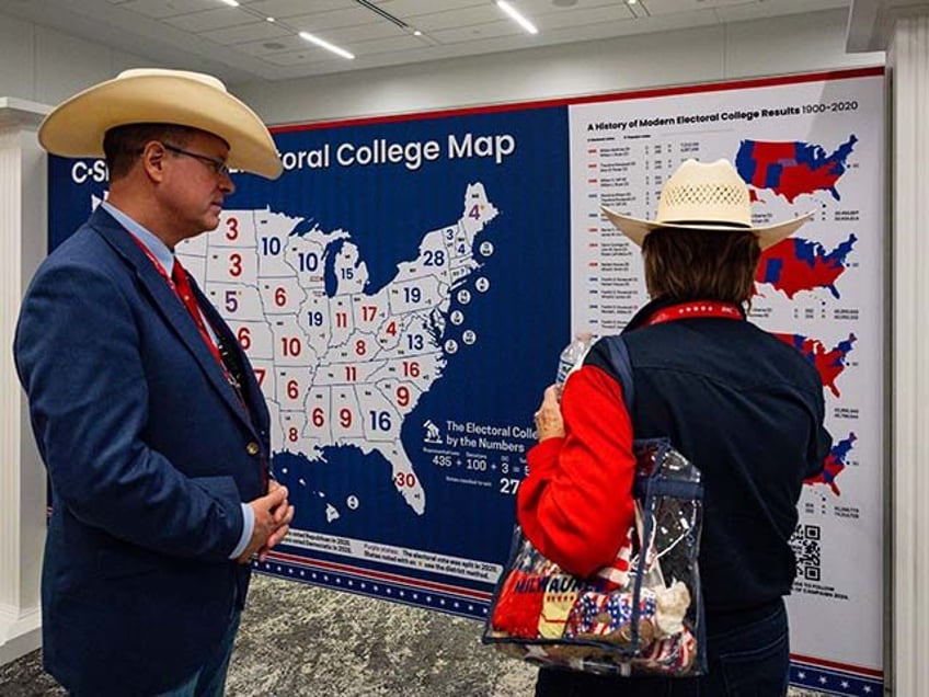 Attendees look at a map of the US electoral college during the Republican National Convent