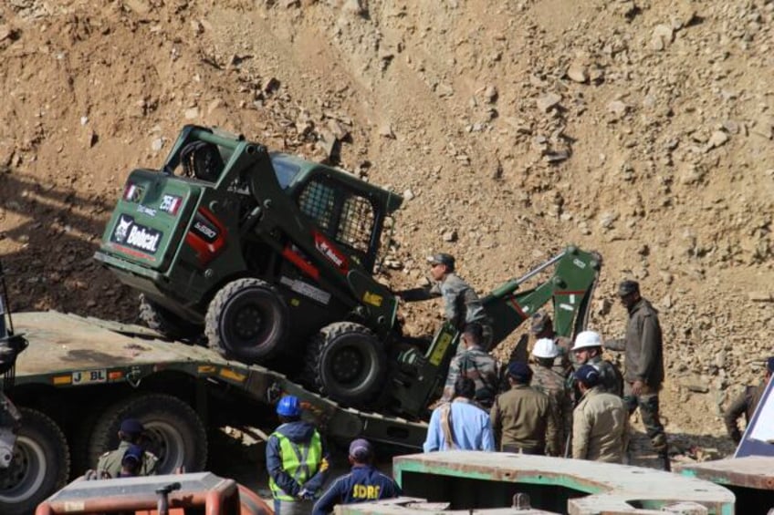 rescuers attempt manual digging to free 41 indian workers trapped for over two weeks in tunnel