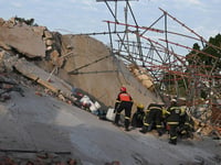 Rescuers make contact with 11 workers buried alive by South Africa building collapse