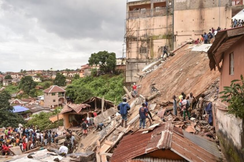 Large crowds gathered around the remains of the structure