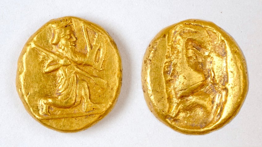 Persian coins displaying an archer on one knee