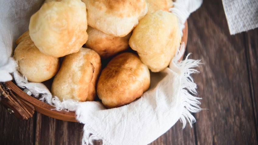 bread rolls sitting in basket