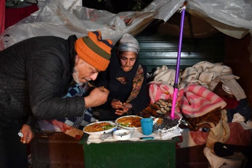 Leila and another Tunis homeless person share the Friday night dinner offered by the 'Rest