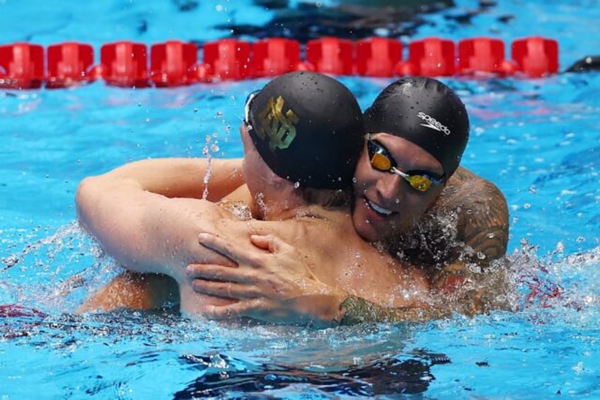 Caeleb Dressel and Chris Guiliano share a hug after finishing one-two in the 50m freestyle