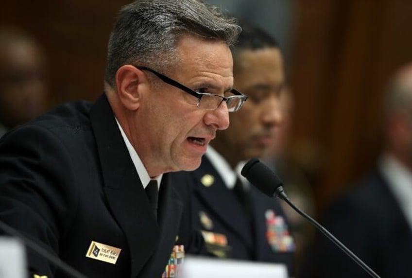 Retired US Navy Admiral Robert Burke is accused of steering contracts to a firm in return