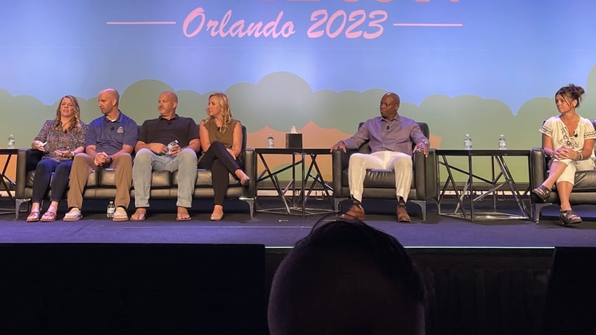 David Robinson on stage along with the parents of Gabby Petito and Candice Cooley, the mother of Dylan Rounds