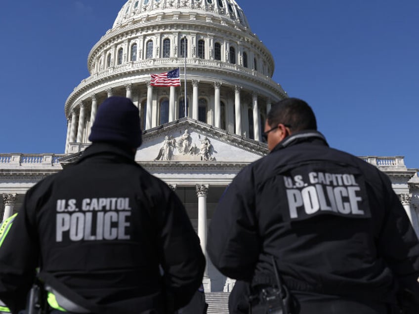 U.S. Capitol police officers gather on the east front plaza of the Capitol on February 28,