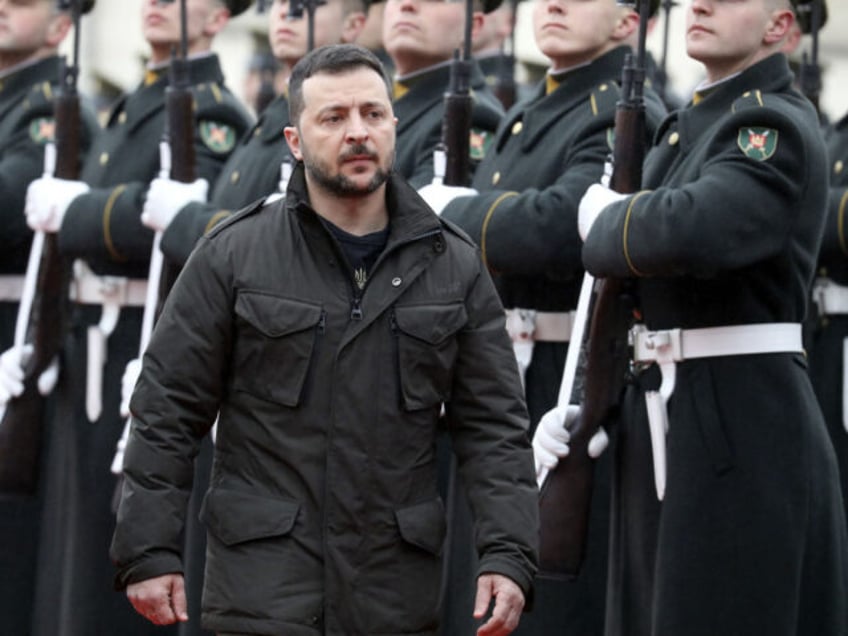 Ukraine's President Volodymyr Zelensky inspect a military honor guard with Lithuania's President (unseen) during a welcoming ceremony at the Presidential Palace in Vilnius, Lithuania, on January 10, 2024. (Photo by PETRAS MALUKAS / AFP) (Photo by PETRAS MALUKAS/AFP via Getty Images)