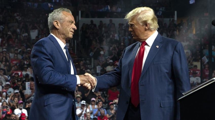 Kennedy and Trump shake hands