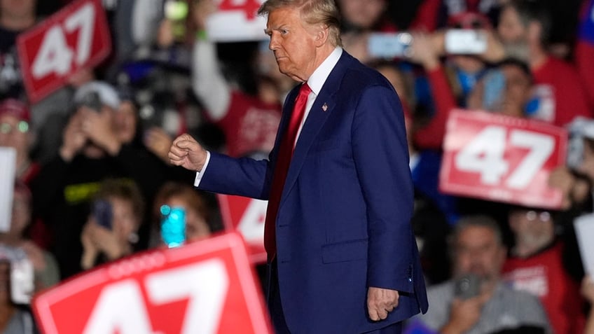 Republican presidential nominee former President Trump departs after speaking during a campaign rally at the Suburban Collection Showplace, Oct. 26, 2024, in Novi, Mich.