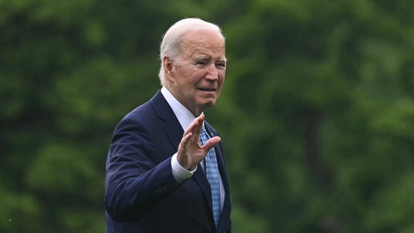 Biden waves while walking to Marine One