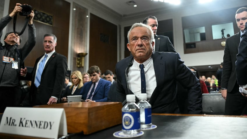 US Secretary of Health and Human Services nominee Robert F. Kennedy Jr. takes his seat as he arrives during a Senate Finance Committee hearing on his nomination to be Health and Human Services Secretary, on Capitol Hill in Washington, DC, January 29, 2025. 