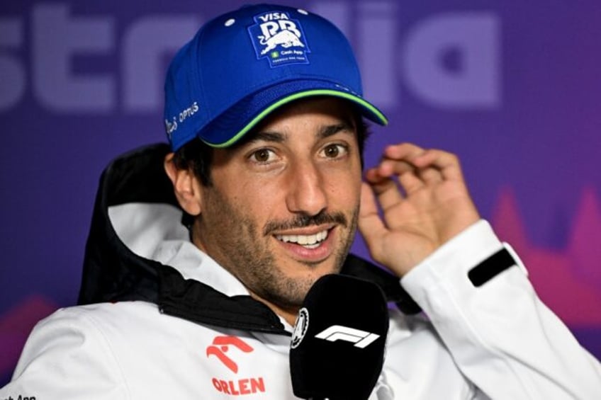 RB's Australian driver Daniel Ricciardo speaks at a press conference in Melbourne