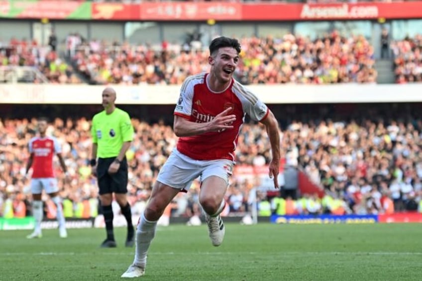 rice scores as arsenal hit back to beat man utd