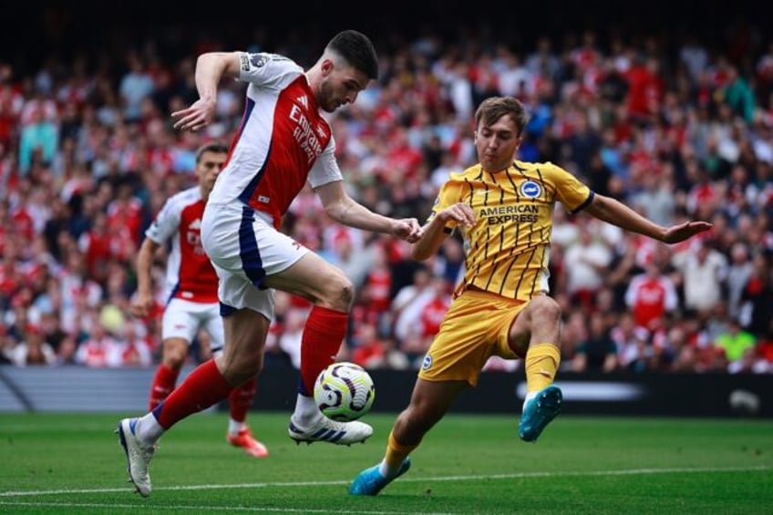 Arsenal midfielder Declan Rice (R) was sent off against Brighton