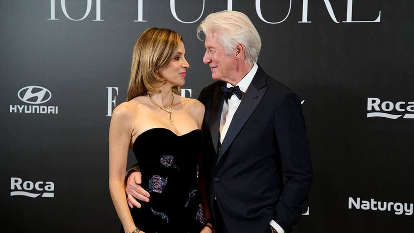 Richard Gere embracing wife Alejandra