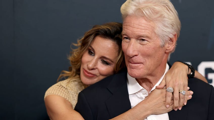 Alejandra Silva with her arms around husband Richard Gere