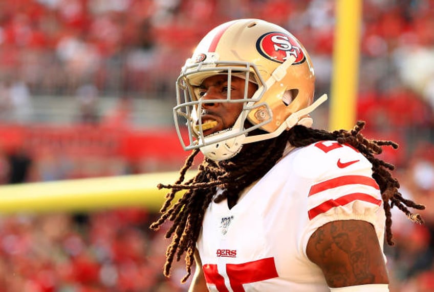 Richard Sherman of the San Francisco 49ers celebrates an interception returned for a touchdown during a game against the Tampa Bay Buccaneers at...