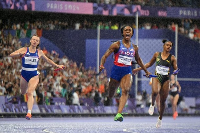 Sha'Carri Richardson celebrates after clinching gold for the USA in the women's 4x100m rel