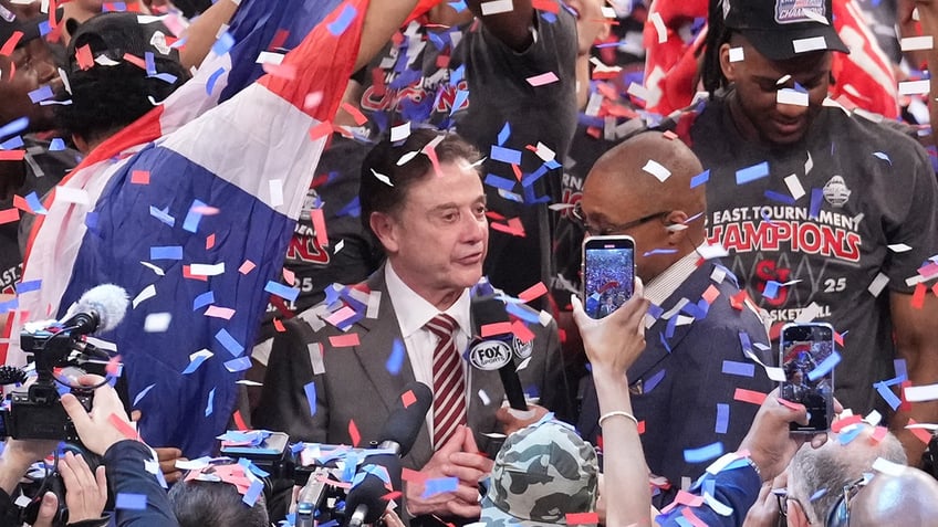 Rick Pitino celebrates