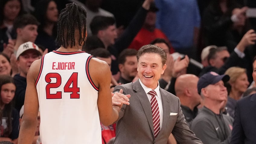 Rick Pitino and Zuby Ejiofor