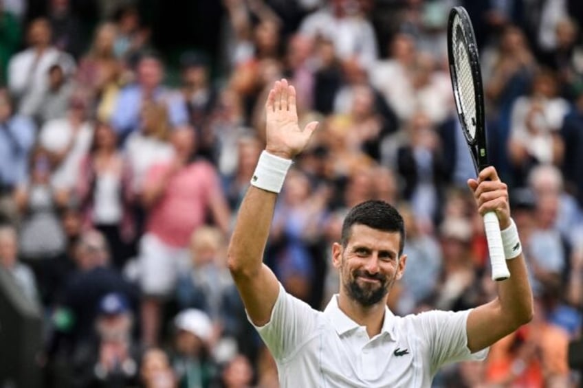 Snooker rookie: Novak Djokovic celebrates winning against Czech Republic's Vit Kopriva