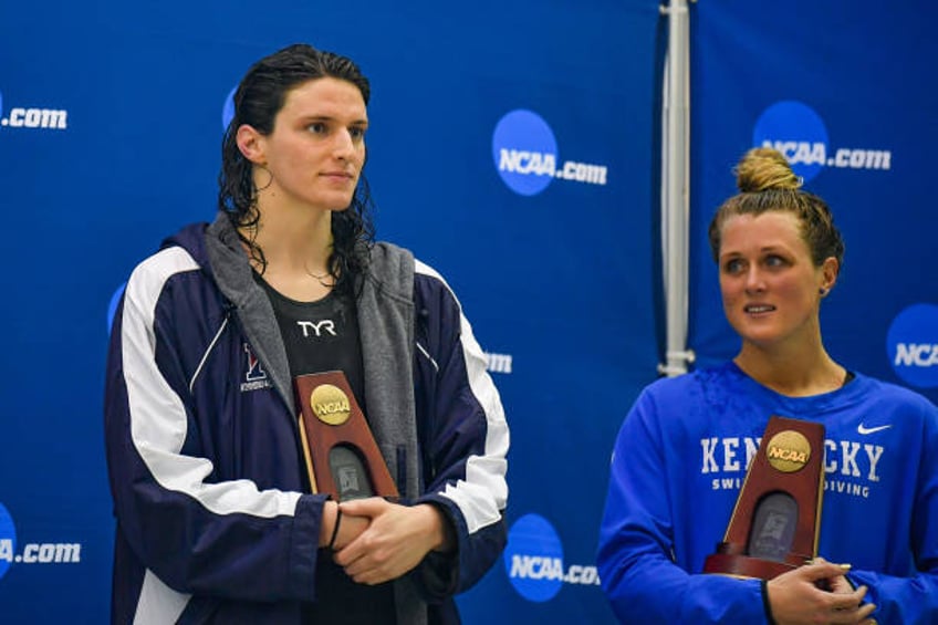 University of Pennsylvania swimmer Lia Thomas and Kentucky swimmer Riley Gaines react after finishing tied for 5th in the 200 Freestyle finals at the...