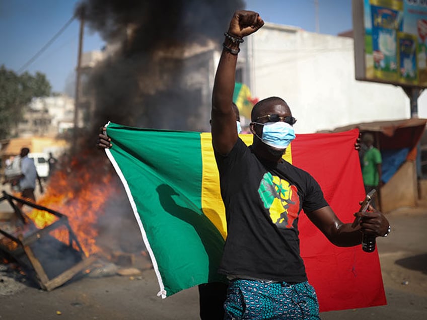 Supporters of opposition presidential candidates gather at the Saint-Lazare intersection to continue their campaign following the indefinite postponement of Senegal's Feb. 25 presidential election in Dakar, Senegal on February 4, 2024. (Photo by Cem Ozdel/Anadolu via Getty Images)