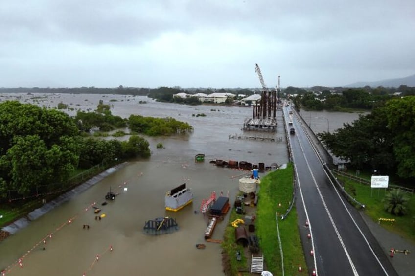 Rising floodwaters swamp areas around Townsville in northeastern Australia