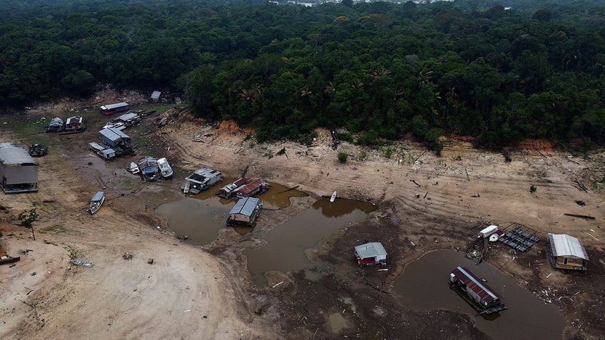 rivers in the amazon fall to record low levels as drought worsens