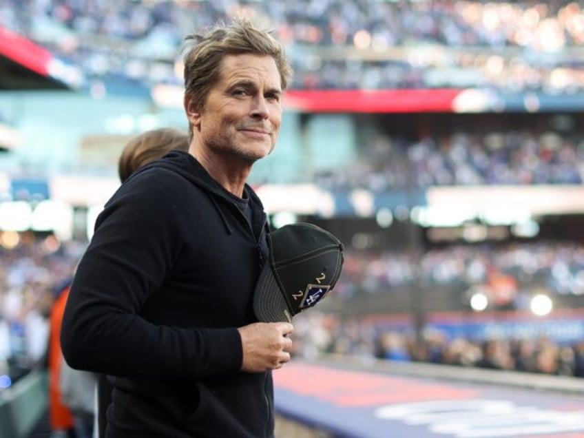 NEW YORK, NY - OCTOBER 18: Rob Lowe stands for the national anthem prior to Game 5 of the