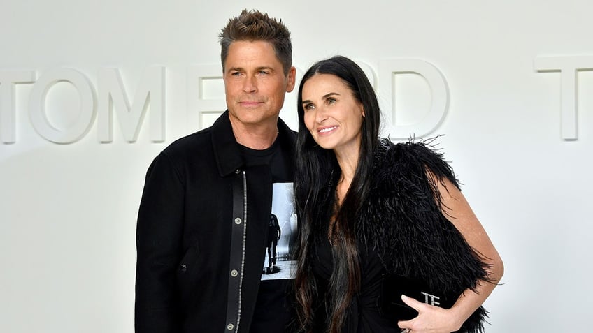 Rob Lowe with Demi Moore at an event